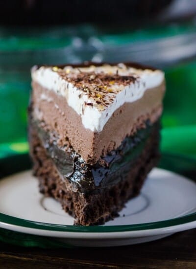 Irish Cream Coffee Mud Pie | Coffee turned into pie? Chocolate cookie crust, a flourless chocolate whiskey cake, a layer of chocolate espresso pudding, an Irish cream chocolate mousse, topped off with a sweet whipped cream - it's a chocoholic's dream!
