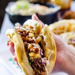 Watch your back, tortillas - stuffed with slow cooked BBQ pulled pork and pineapple coleslaw, these Pulled Pork Waffle Tacos are coming to take Tuesdays away from you!