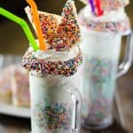 This Fairy Bread Funfetti Milkshake is bound to be a new after school favorite! Dress up those simple vanilla milkshakes with a mountain of whipped cream, tons of sprinkles, and some mini Fairy Bread slices!