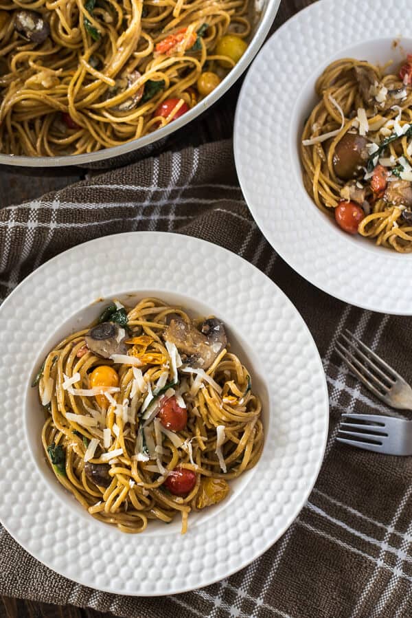 Looking for a delicious quick & easy weeknight meal? It doesn't get much better than One Pot Tomato Basil Pasta - linguine, fresh veggies, and a light, creamy sauce make this a dinner worth repeating!