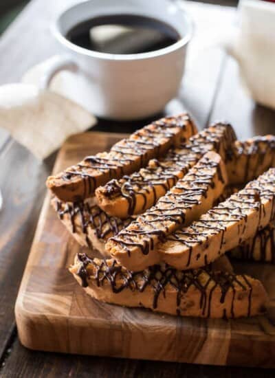 Chock full of toasted coconut, salted caramel chips, and a healthy chocolate drizzle, these Salted Caramel Coconut Biscotti will make you look forward to your morning coffee even more than you already do!