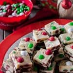 This Triple Chocolate M&M Peppermint Bark Fudge turns three holiday favorites in one! Soft, minty chocolate and white chocolate fudge studded with holiday M&M’S® is a fun treat to eat and gift!