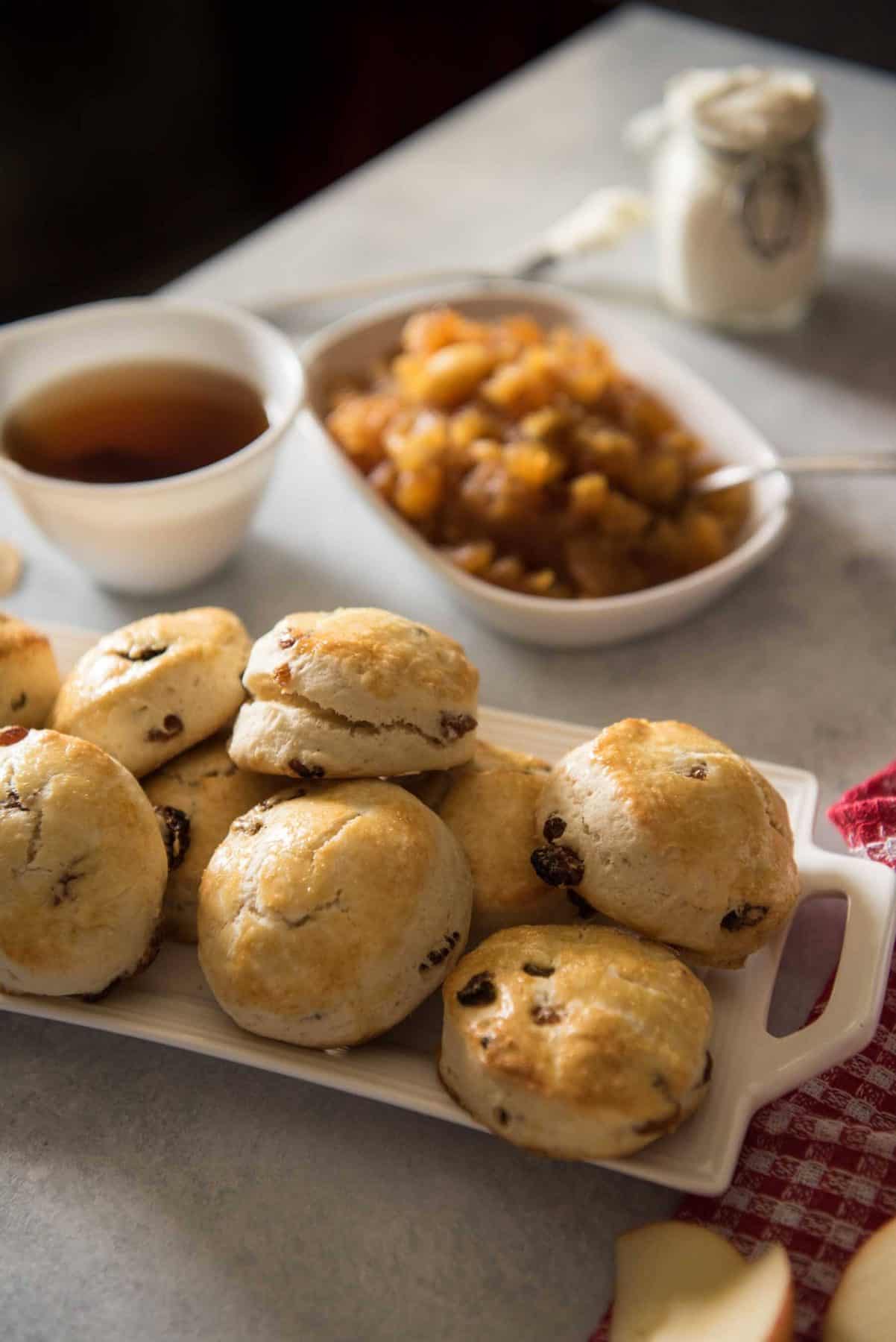 Perfect for brunch or as part of your afternoon tea time, these English Raisin Scones with Apple Jam are slightly sweet, fluffy, unique version of the popular British pastry.