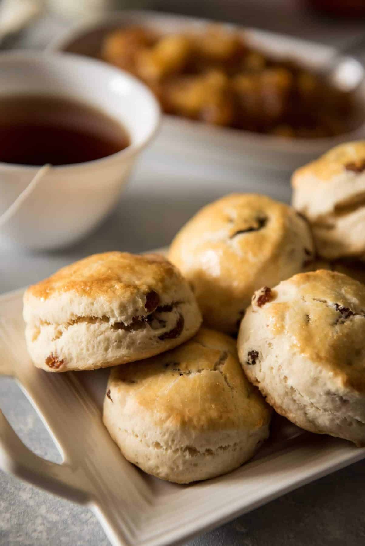Perfect for brunch or as part of your afternoon tea time, these English Raisin Scones with Apple Jam are slightly sweet, fluffy, unique version of the popular British pastry.