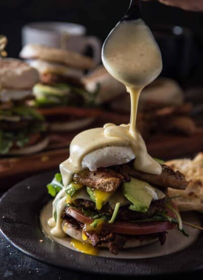 You think you do brunch? The Ultimate Brunch Burger is a foodie's dream - a beef & sausage patty, crispy pork belly, cheddar cheese, hash browns, avocado, a poached egg, tomato, and arugula, all topped with homemade spicy Hollandaise.