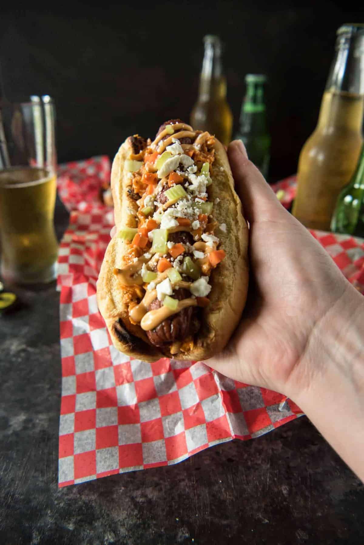 Summer grilling with a kick! Top your Buffalo Hot Dogs with shredded Buffalo chicken, zesty Buffalo mayo, chopped celery & carrots, and blue cheese (or Feta for BCHaters) for a change of pace in your hum-drum dog game!