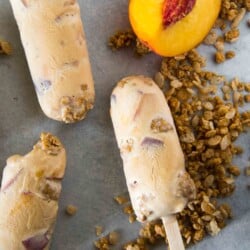 This cool dessert pops! These Caramel Peach Crisp Ice Cream Pops combine the goodness of summer peaches and the fun of a crumbly crisp with rich, creamy, light caramel ice cream.
