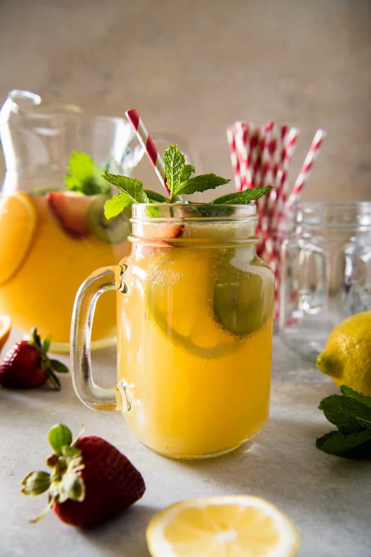  Cool down these hot summer days with a pitcher of Orange Lemonade Twist Punch! Fizzy, spicy, and fruity, this refreshing drink is sure to wow your friends & family!