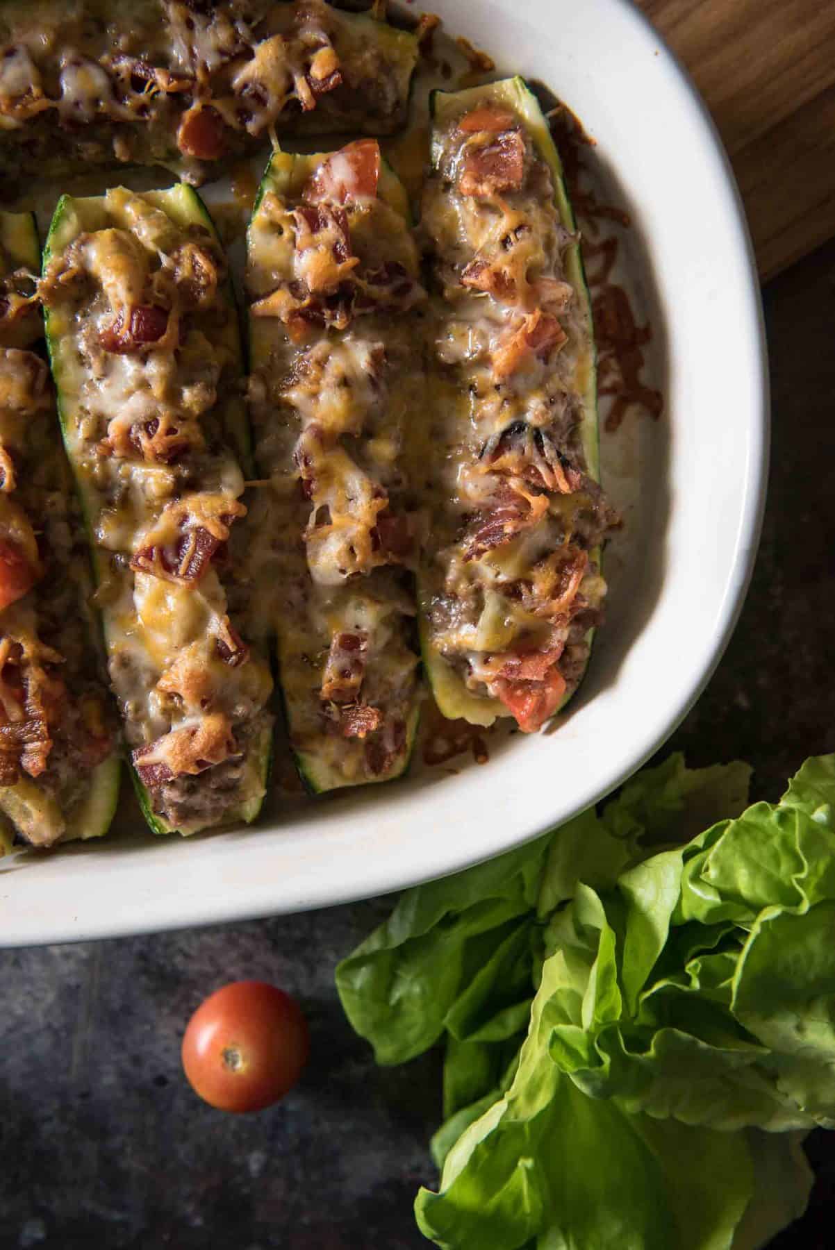 top view of freshly baked ground beef zucchini boats in a casserole dish