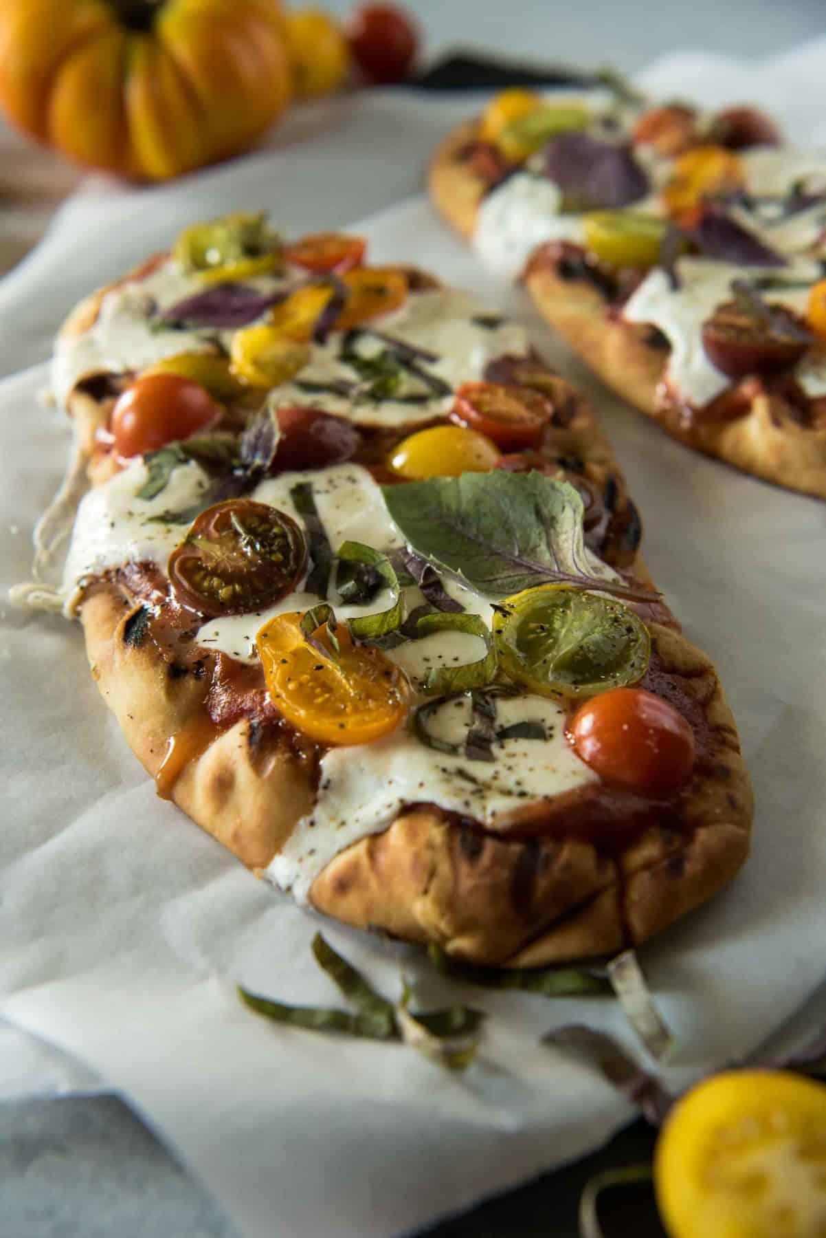 In need of a quick weeknight dinner? This Grilled Margherita Flatbread is all the delicious pizza taste you want with much less work.