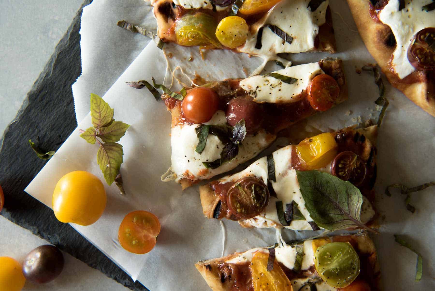 In need of a quick weeknight dinner? This Grilled Margherita Flatbread is all the delicious pizza taste you want with much less work.