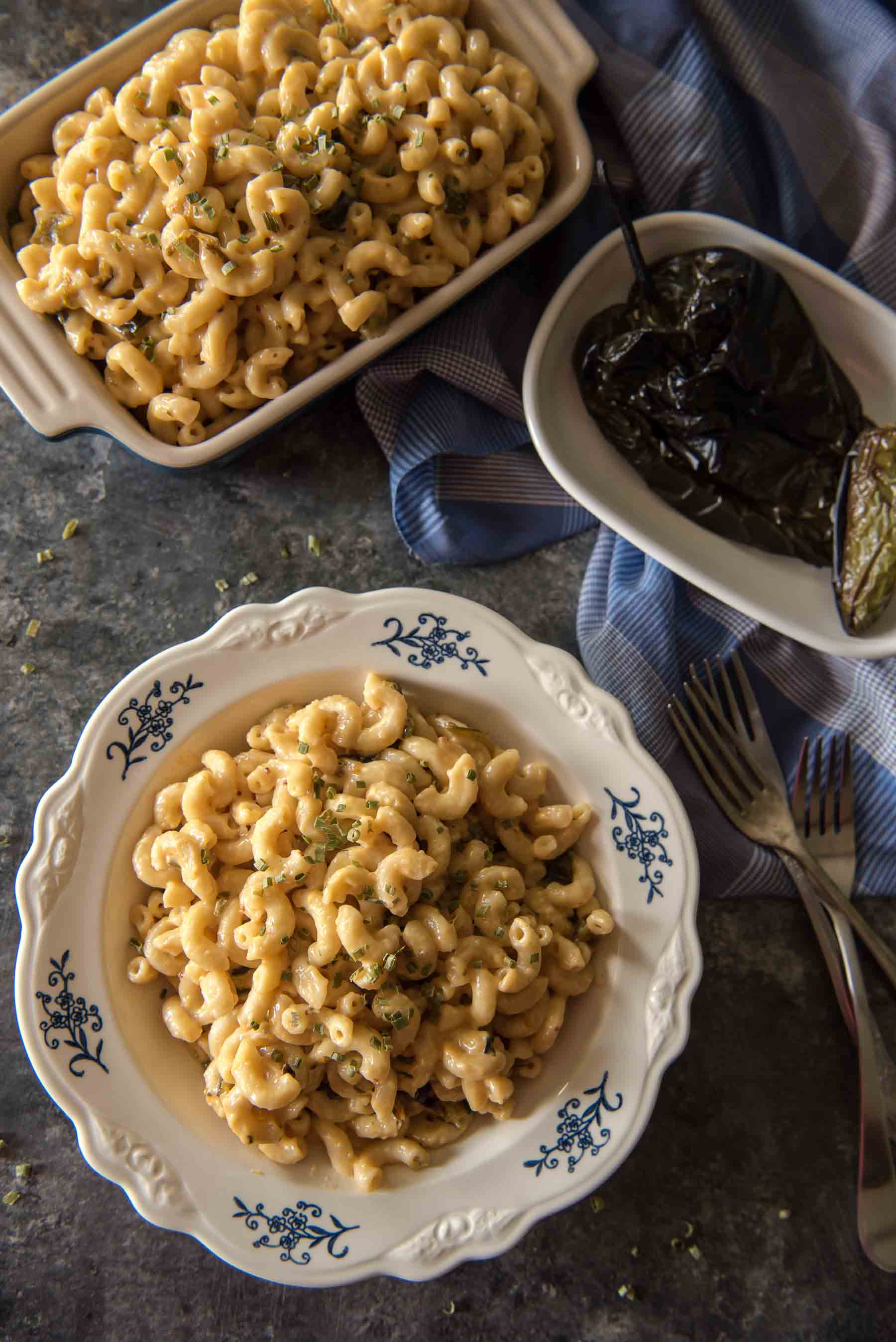 Fresh jalapenos heat up this Instant Pot Mac and Cheese with Roasted Poblanos - but delicious, creamy layers of cheese cool it all down, making this side dish perfect for all ages & palates! 