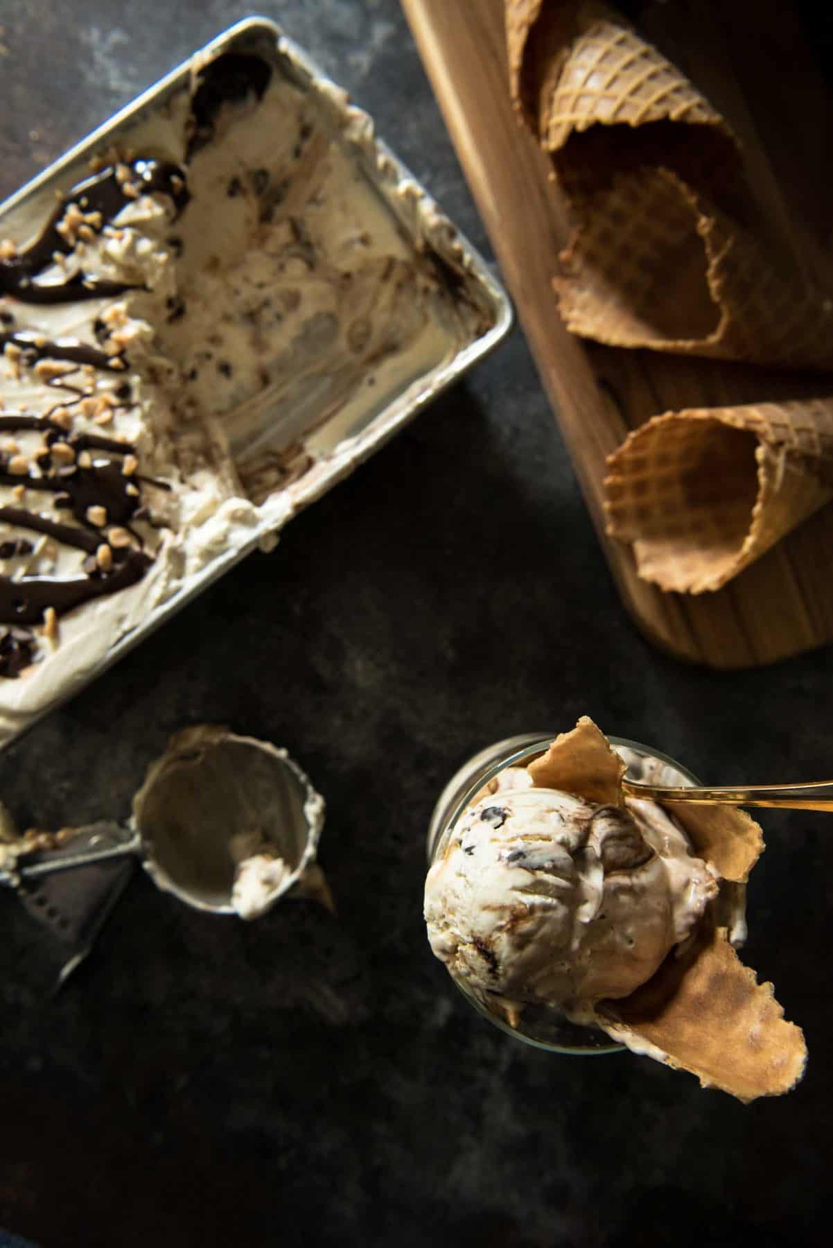 This No-Churn Mocha Toffee Cheesecake Ice Cream is made with only 6 ingredients! This easy cheesecake ice cream is swirled with hot fudge and toffee bits, and requires no ice cream maker! 