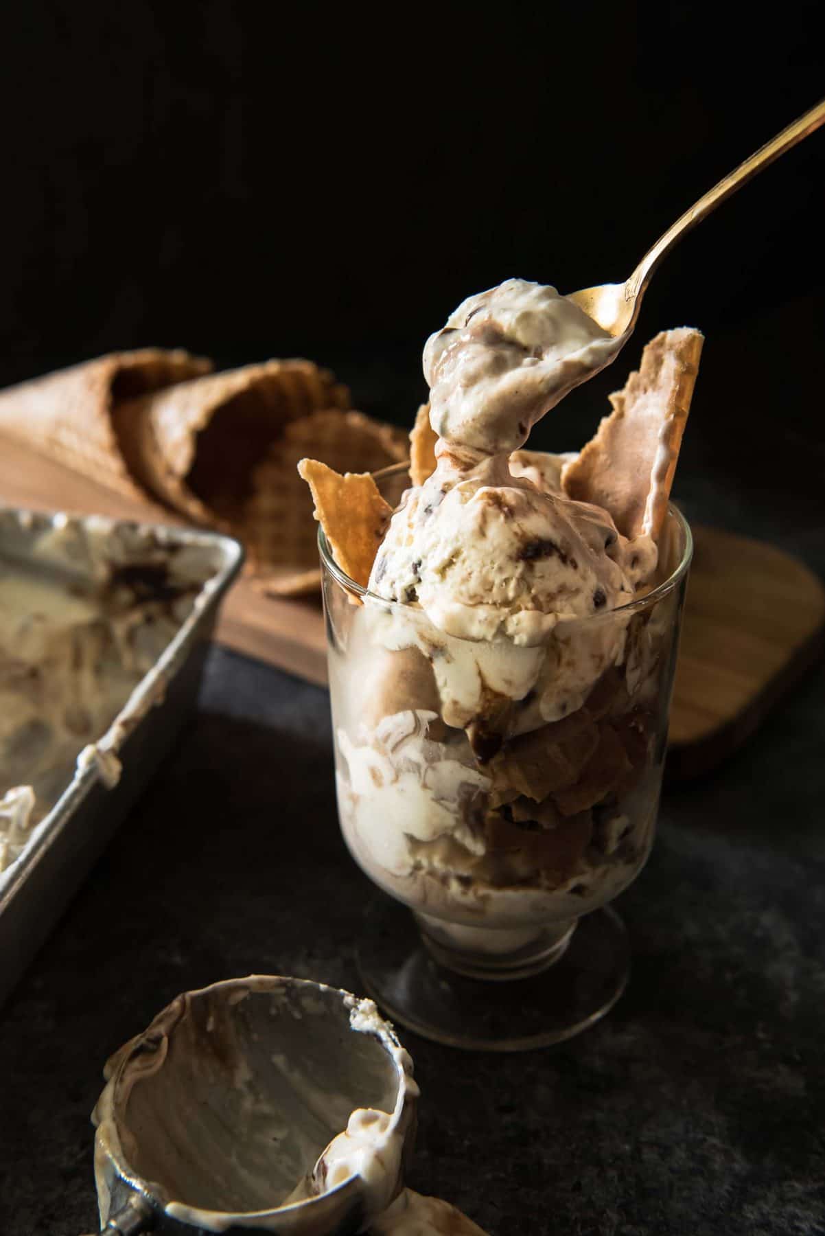 This No-Churn Mocha Toffee Cheesecake Ice Cream is made with only 6 ingredients! This easy cheesecake ice cream is swirled with hot fudge and toffee bits, and requires no ice cream maker! 