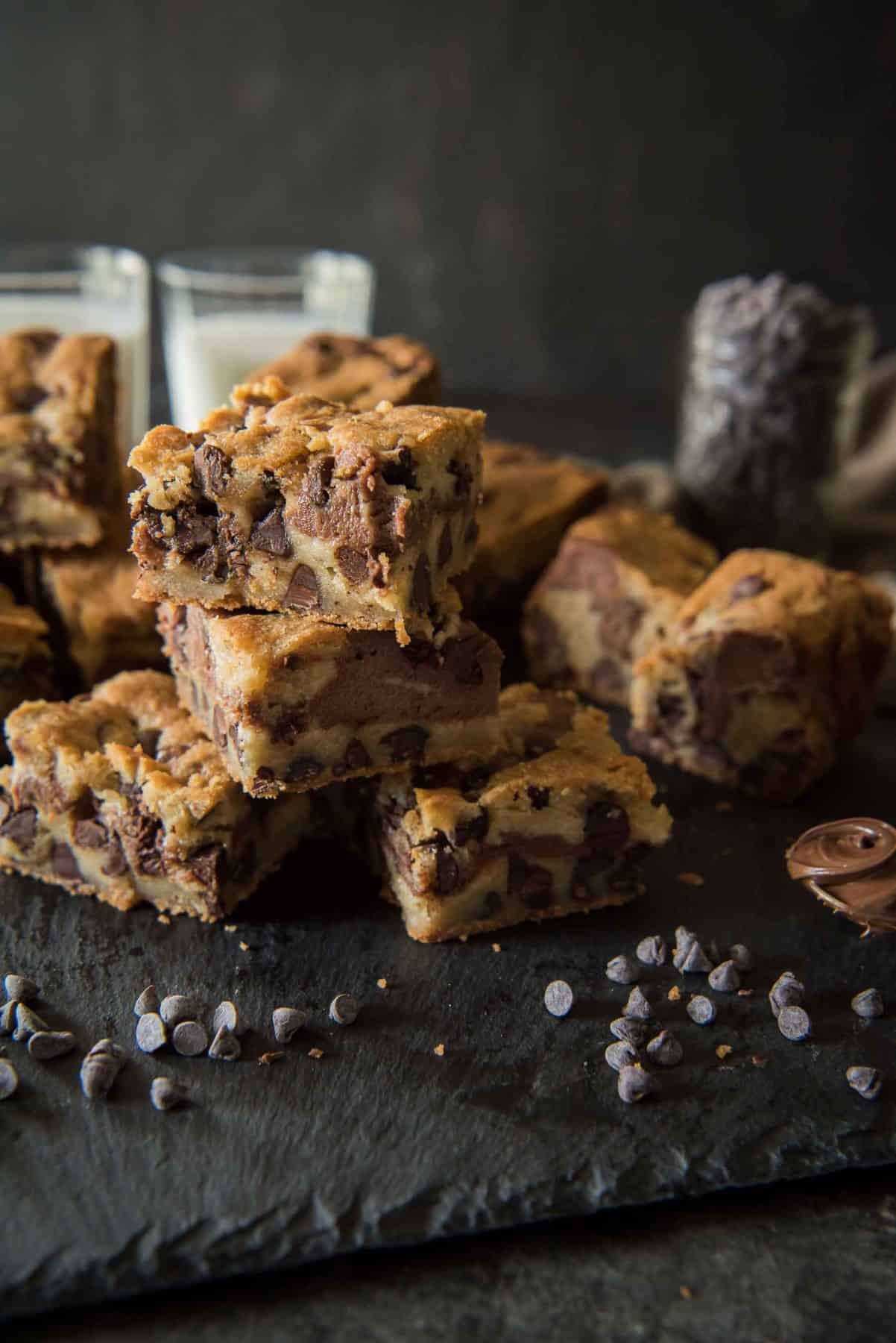 Not a cookie, not a brownie: these Nutella Chocolate Chip Cookie Dough Bars are the softest, chewiest, gooey-est best of both worlds!
