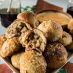 Sweet & Spicy Bratwurst Pretzel Bombs: fluffy balls of baked pretzel dough, filled with chopped bratwurst, cheese, diced fresh jalapenos, and caramelized onions. Homemade beer cheese dip will make these everyone's fave appetizer!