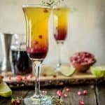 Passion fruit, pineapple, and pomegranate make this fiery Southern Autumn Sunrise Cocktail as welcome on a cool day as it is on a hot day!