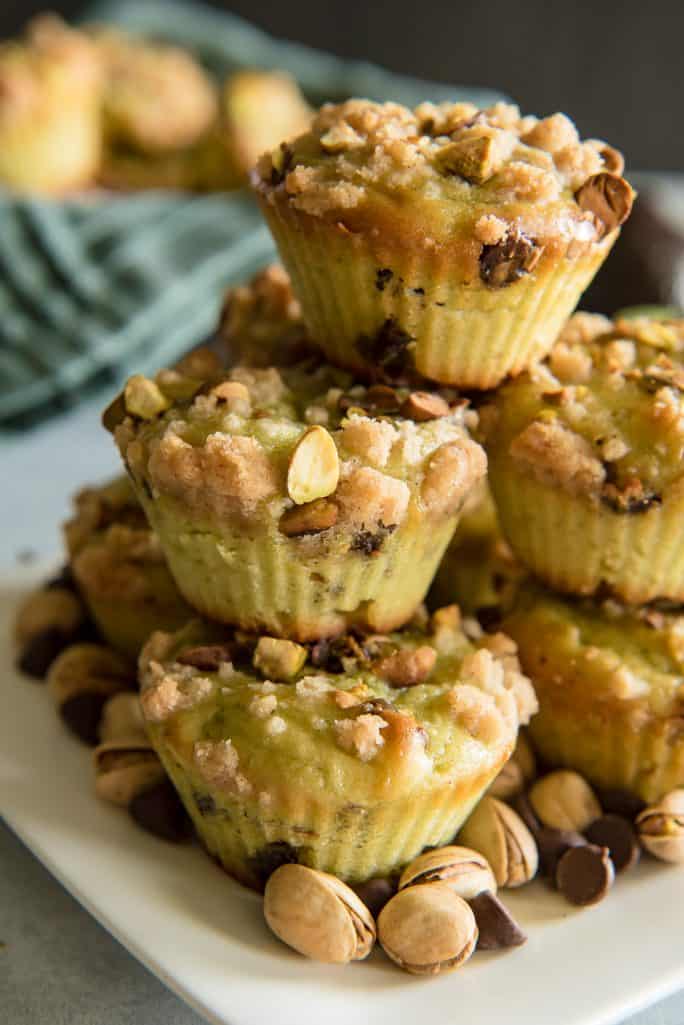 Stack of Avocado Chocolate Chip Muffins with Pistachio Crumble