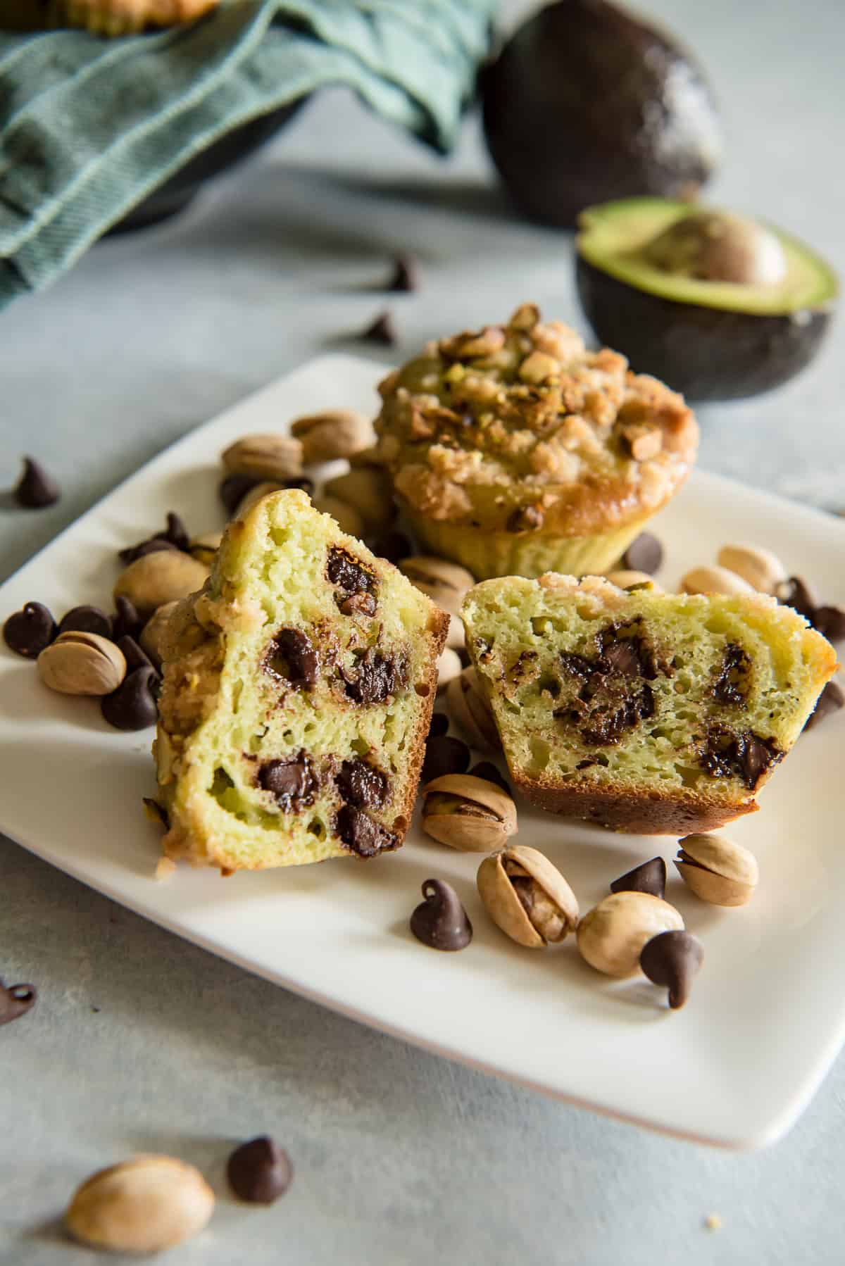 Avocado Chocolate Chip Muffins with Pistachio Crumble cut in half