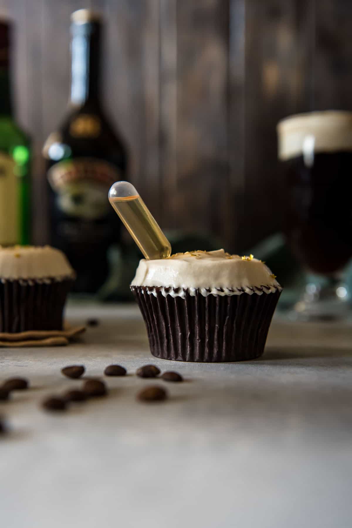 Irish coffee cupcakes with a bottle of Baileys.