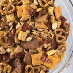 top shot of a large glass bowl filled with bourbon bacon chex mix