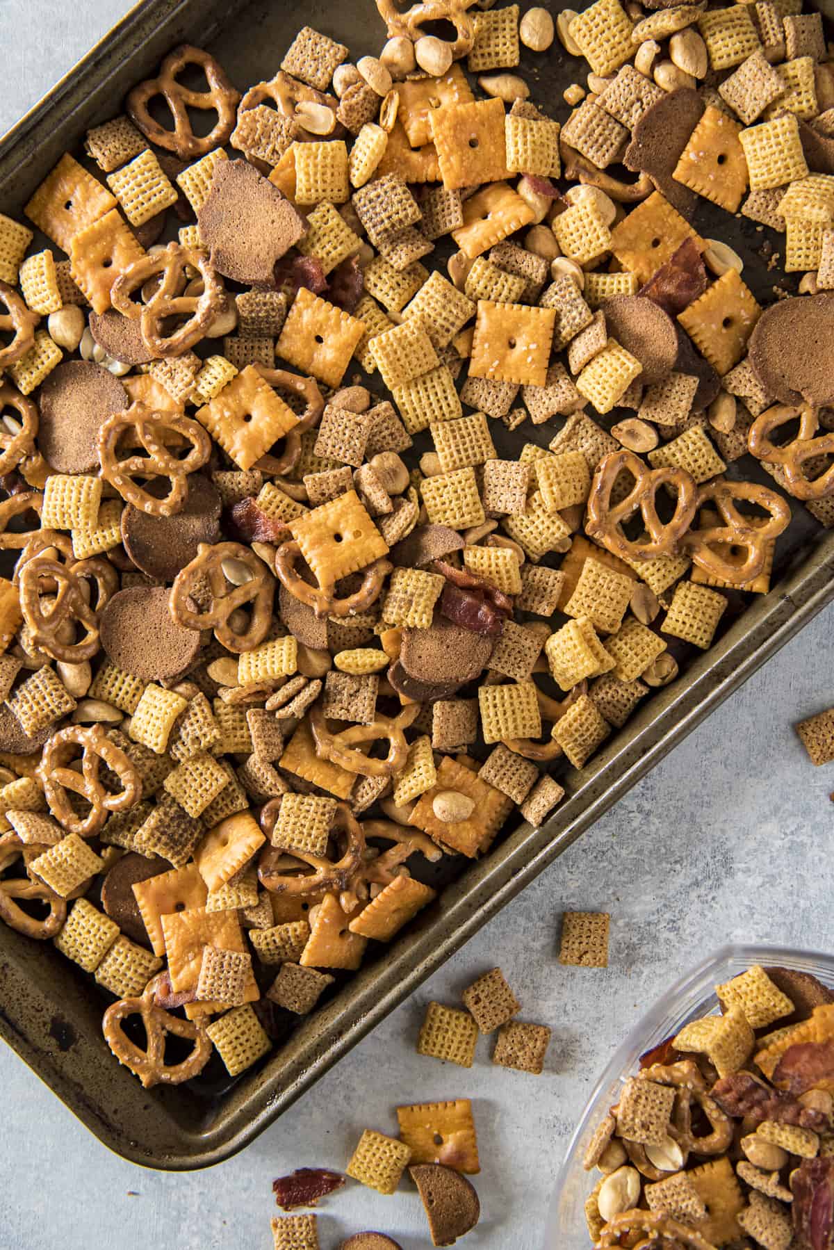 top shot of a sheet pan with bourbon bacon chex mix on it