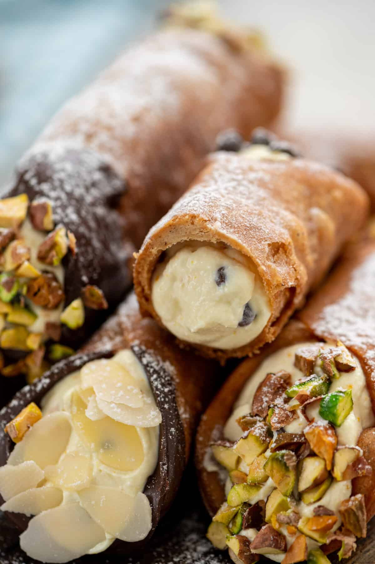 a cannoli cut in half and stacked on other cannoli