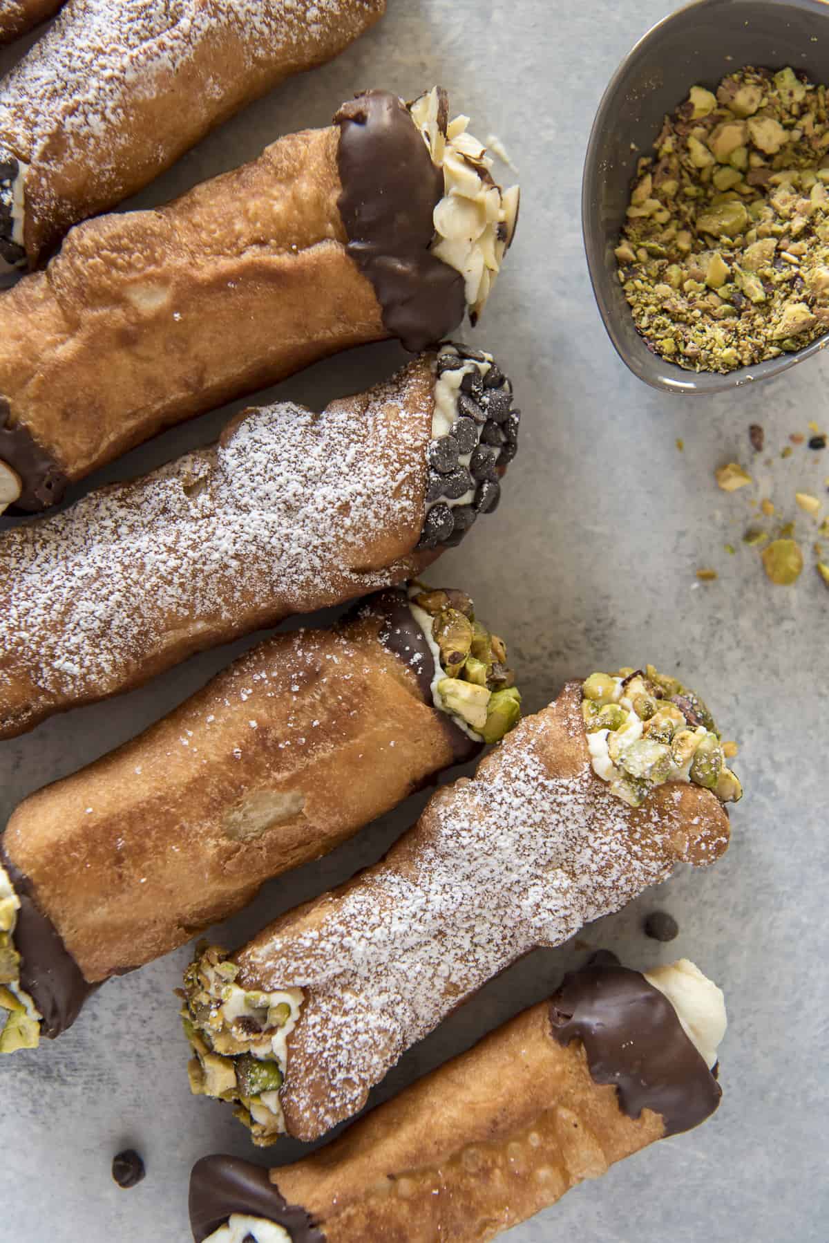 various cannoli arranged next to one another on a table