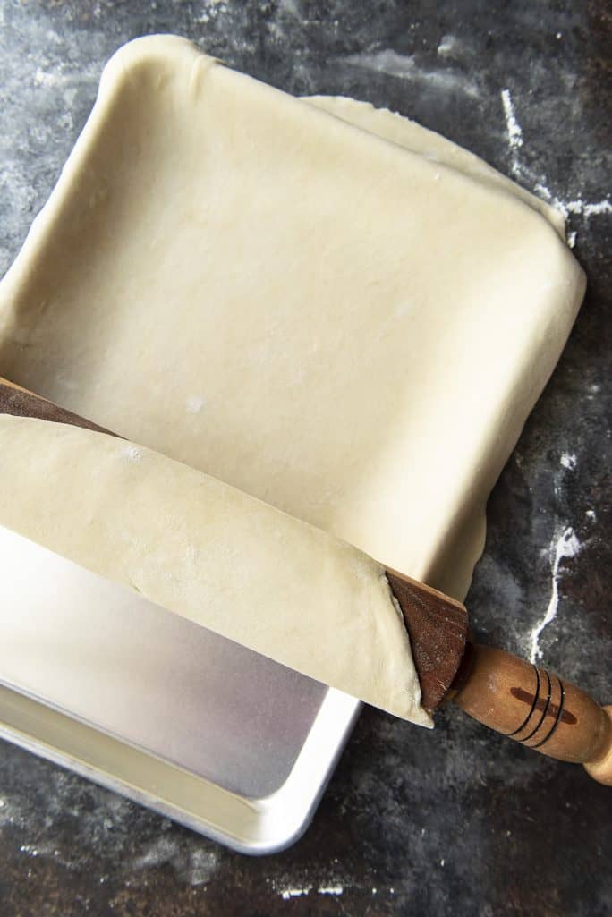 The Best Flaky Pie Crust Recipe rolled in pie pan