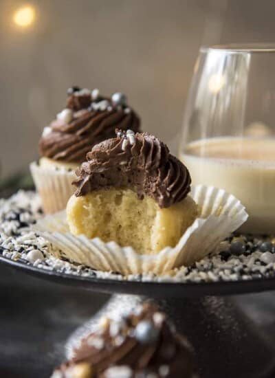 Chocolate Eggnog Cupcakes with a bite taken out of one