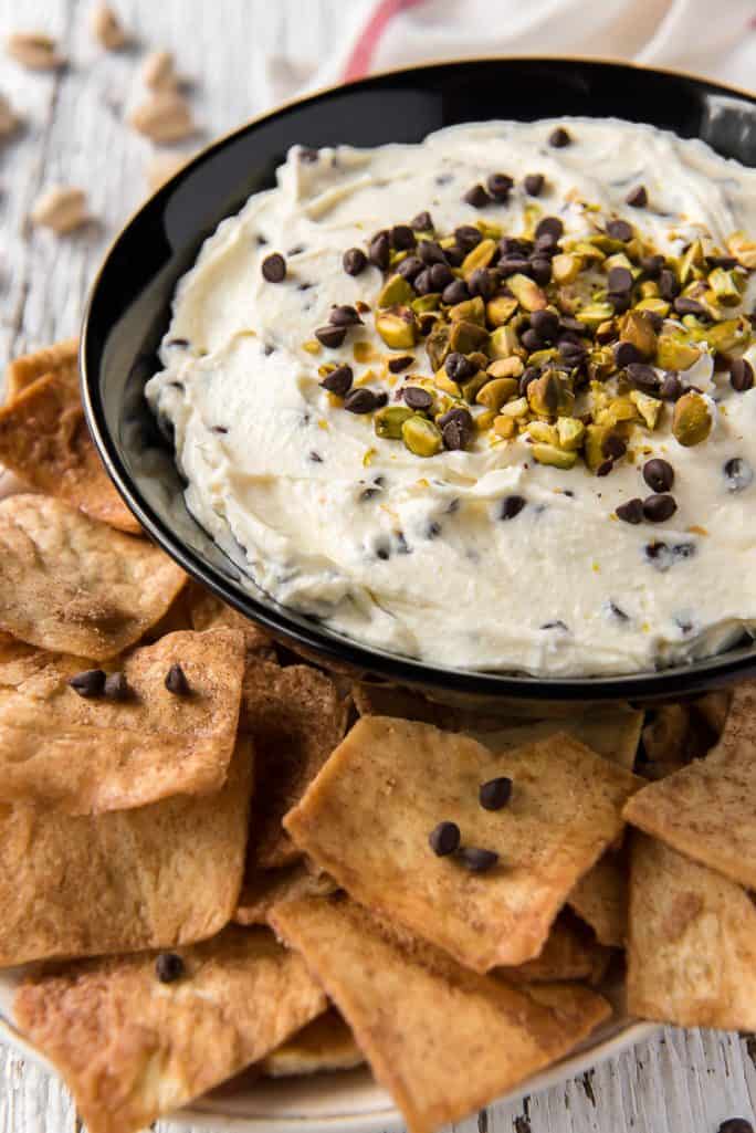 A bowl of Cannoli Dip with cinnamon pita chips