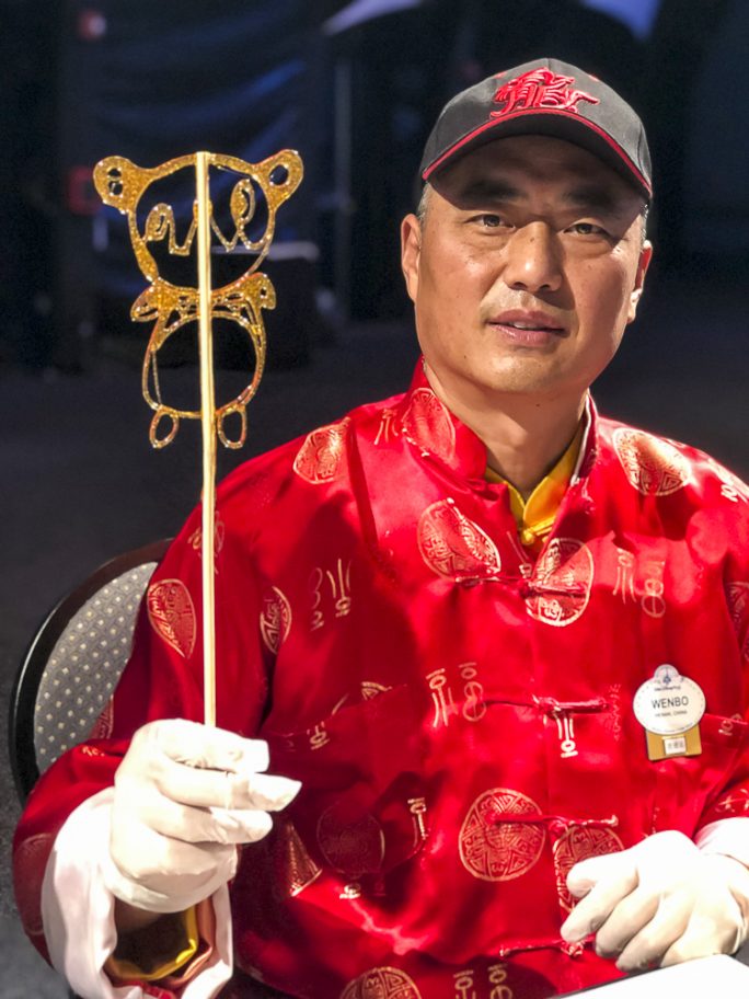 Master Artist Wenbo Zhang creating sugar art at The Painted Panda during the Epcot Festival of the Arts