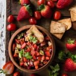 Fresh Tomato Salsa with Strawberries in a bowl served with cinnamon pita chips