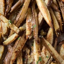 Closeup of baked garlic truffle fries with Parmesan