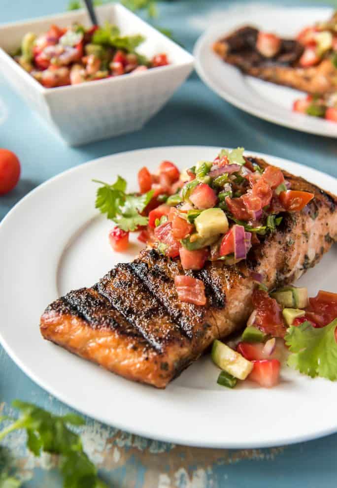 Grilled Salmon on a plate topped with Strawberry Salsa