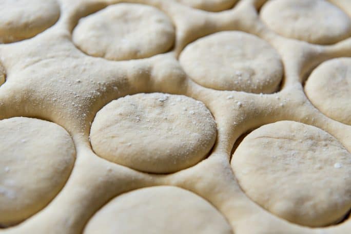 Paczki dough cut into rounds