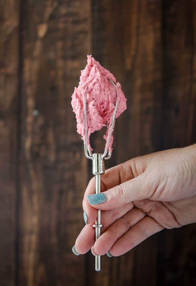 Raspberry Buttercream on the whip of a hand mixer