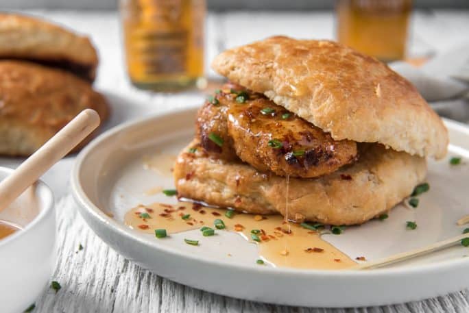 A Buttermilk Fried Chicken Biscuit covered with Hot Honey