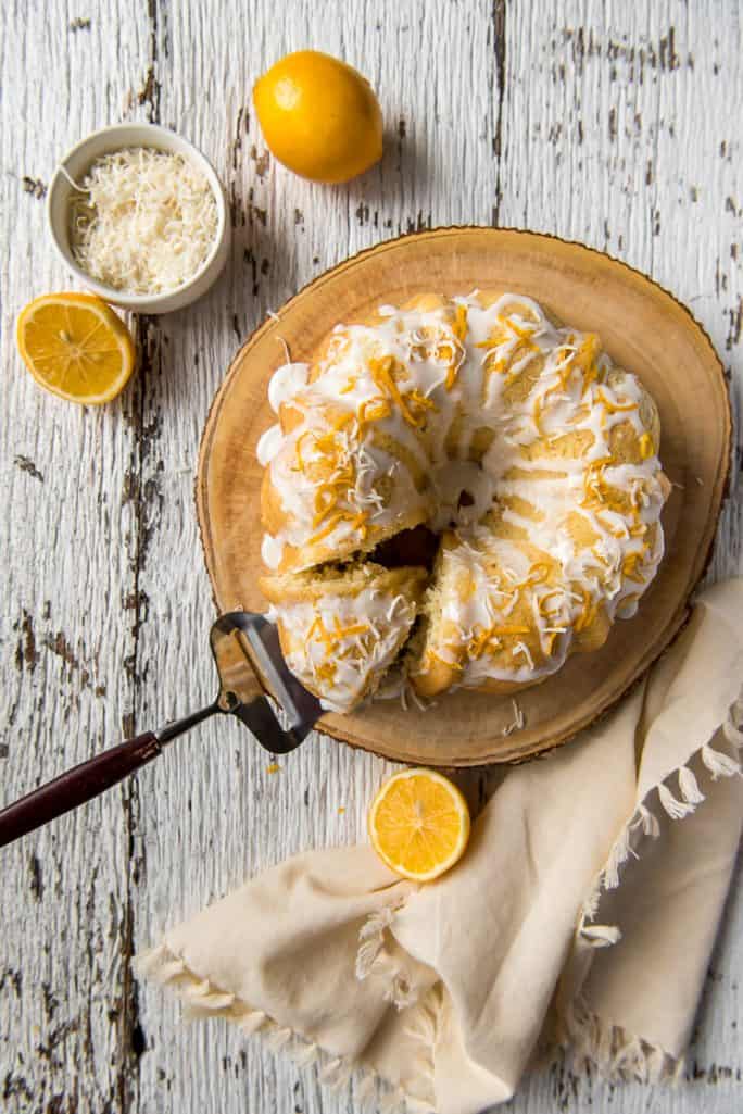 Top shot of Coconut Lemon Pound Cake with a slice cut out of it