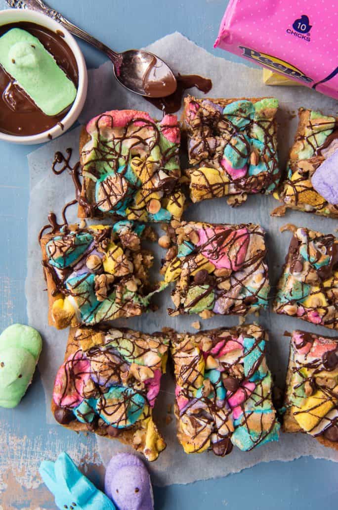Springtime Rocky Road Blondies with a bowl of melted chocolate and marshmallow PEEPS
