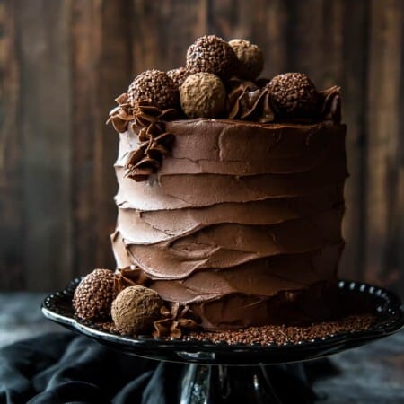 Triple Chocolate Cake on a cake stand