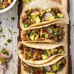 Instant Pot Carnitas Tacos on a cutting board