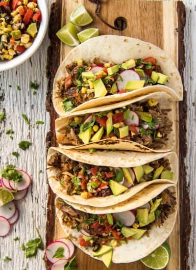 Instant Pot Carnitas Tacos on a cutting board