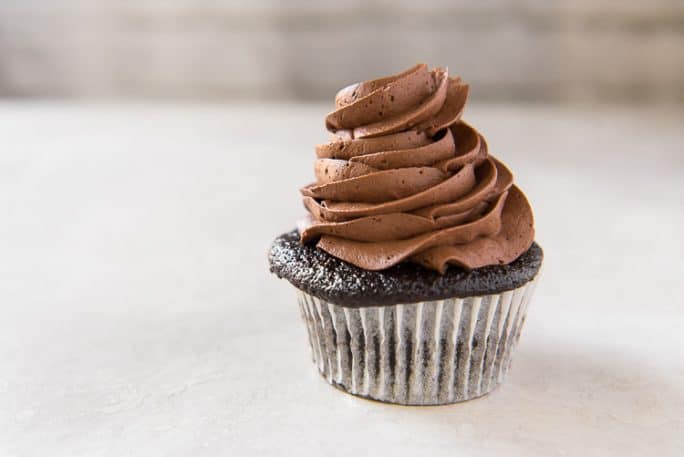 Easy Whipped Chocolate Buttercream Frosting on a chocolate cupcake