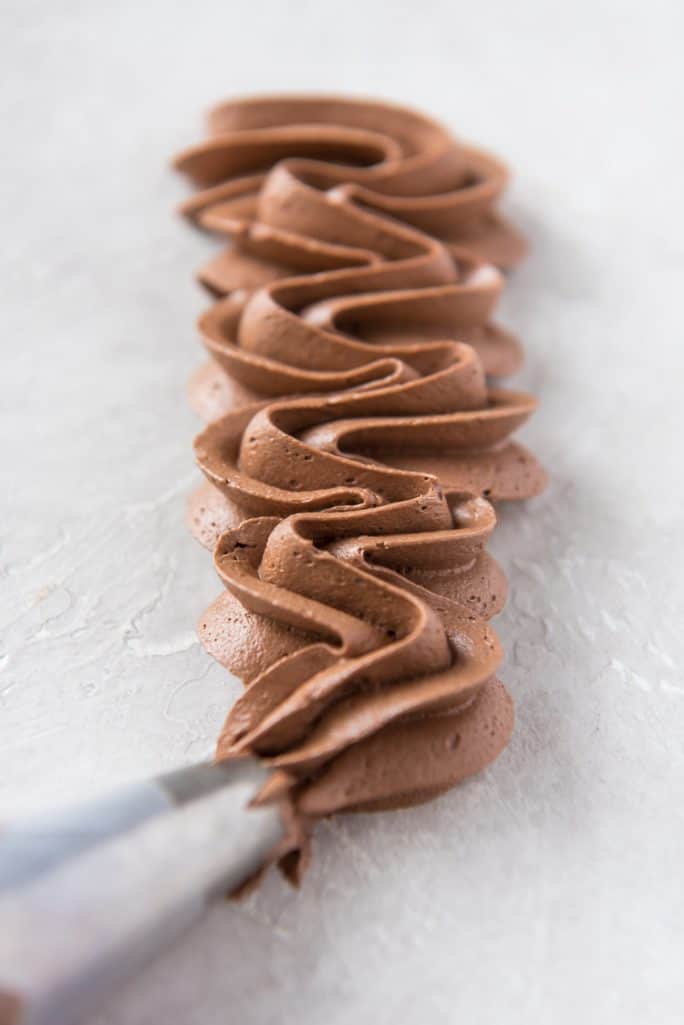 Whipped Chocolate Buttercream Frosting recipe in a piping bag
