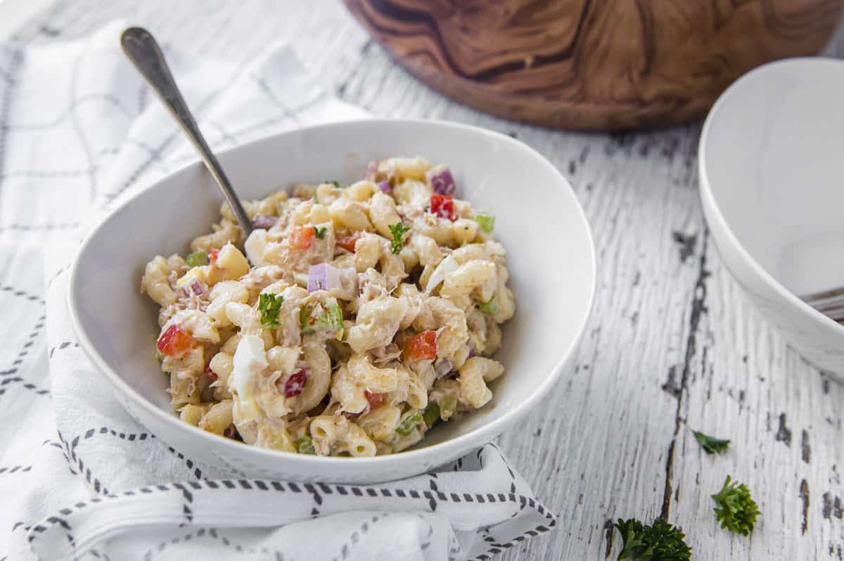 Easy Tuna Macaroni Salad in a white bowl with a fork in it