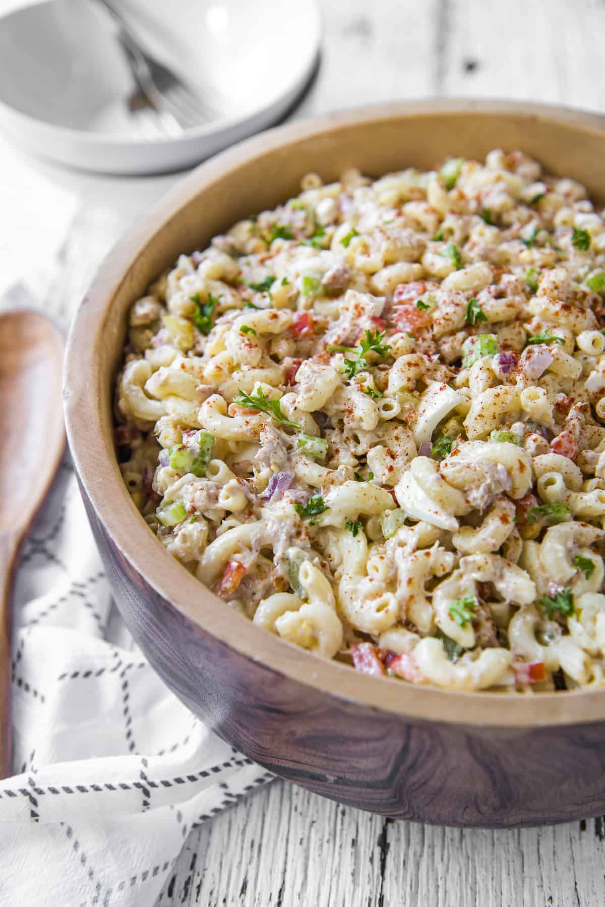 Tuna Macaroni Salad in a large wooden serving bowl