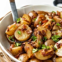 German potato salad in a bowl with a serving spoon