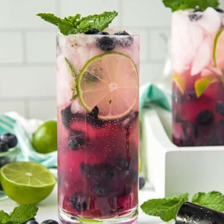 a garnished blueberry cocktail