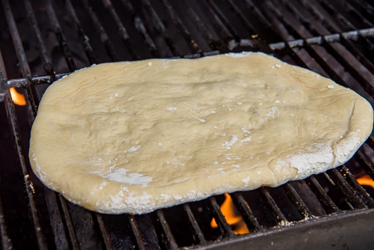 pizza dough on a grill